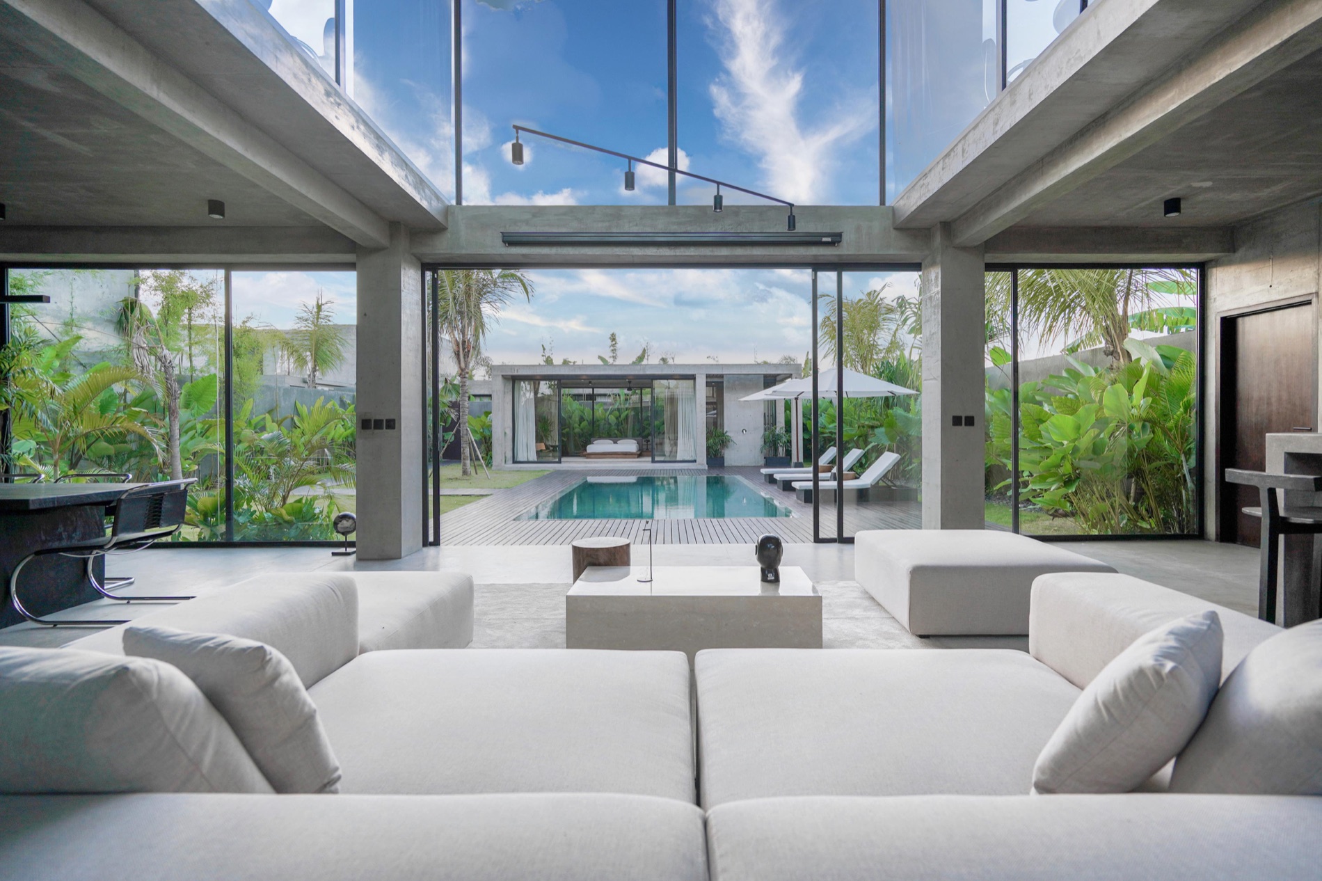 CORE Villa living space opening onto the pool